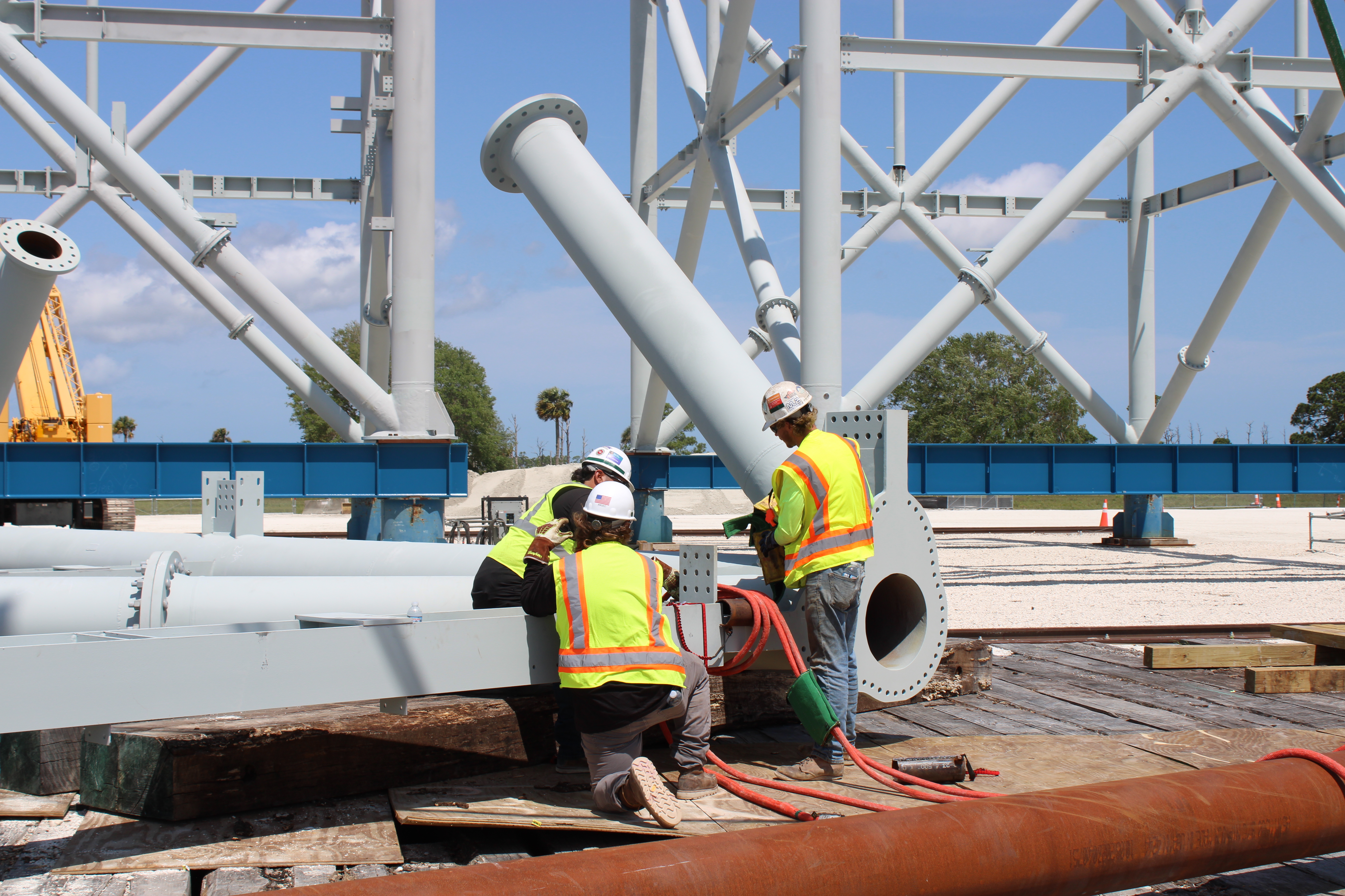 Members of the ML2 Construction Team prepare to assemble a tower module at the Mod Yard. 