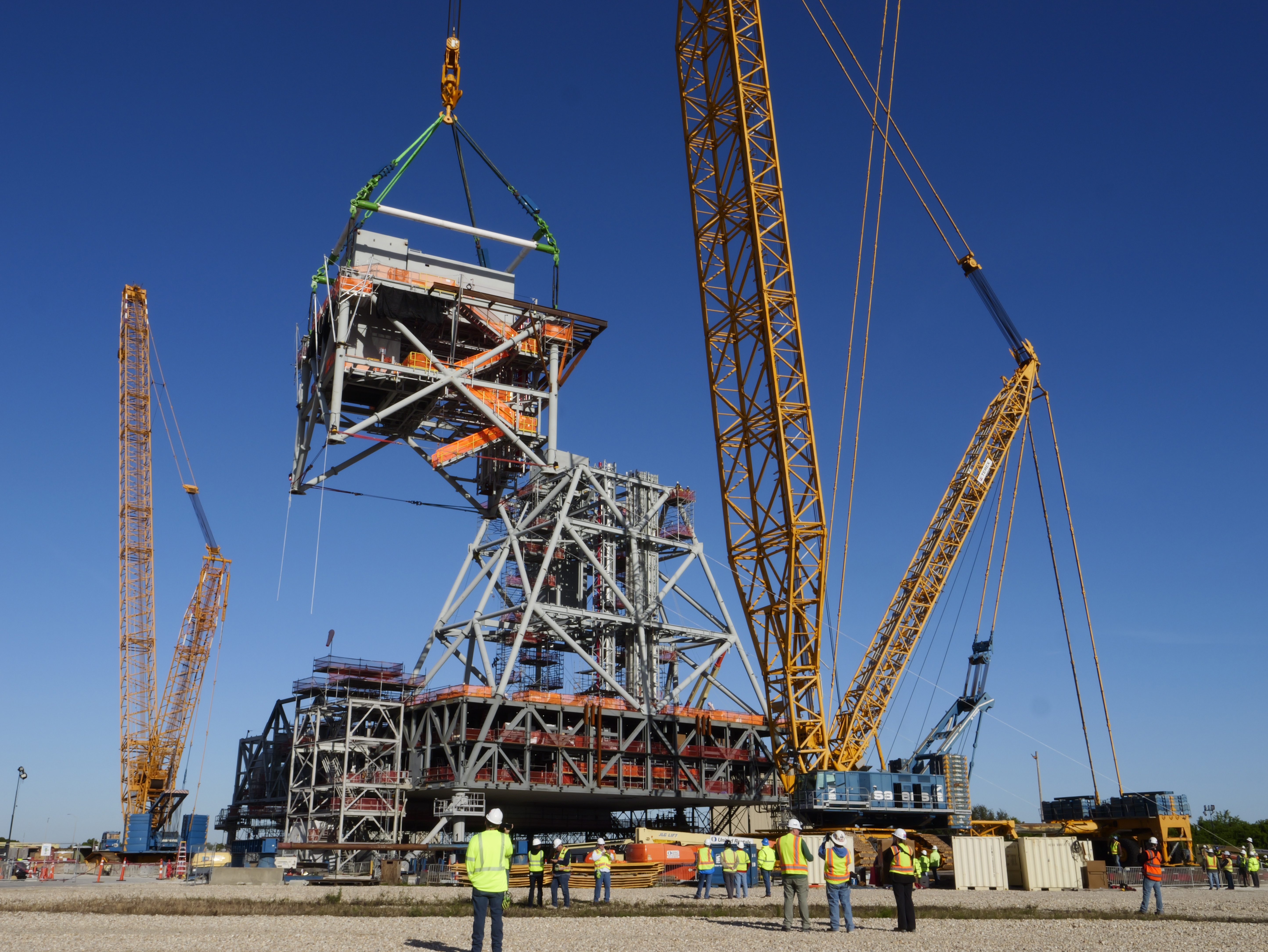 Mod 4 is lifted by a CC8800 Demag crane during Rig and Set at the Mobile Launcher 2 Parksite.