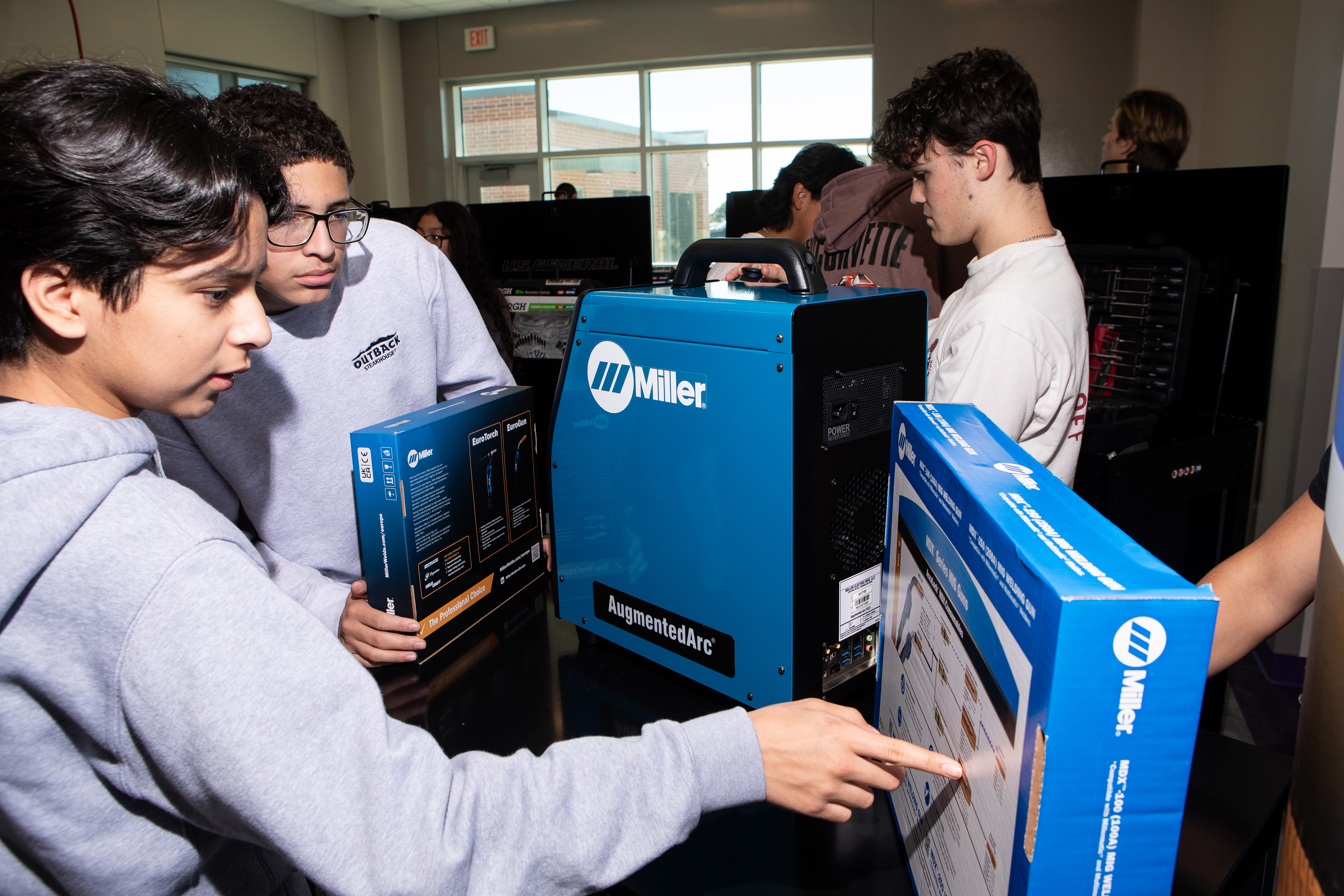 Students learning more about the welding equipment which was donated as part of the $71,000 contribution of tools for vocational education in Sabine Pass and Port Arthur, Texas.