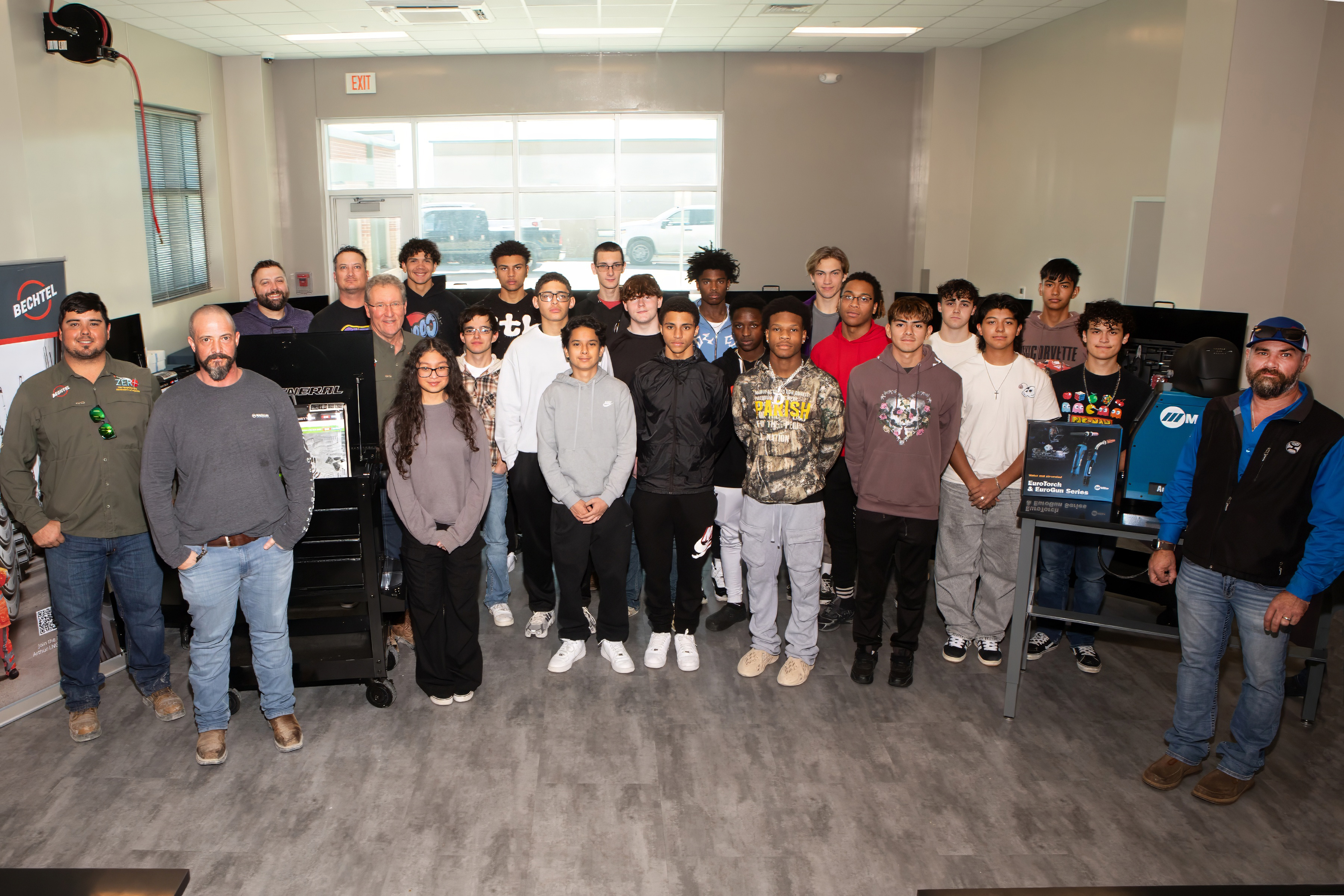 Bechtel and Sabine Pass Independent School District representatives and the group of students pose for a photo during the event.